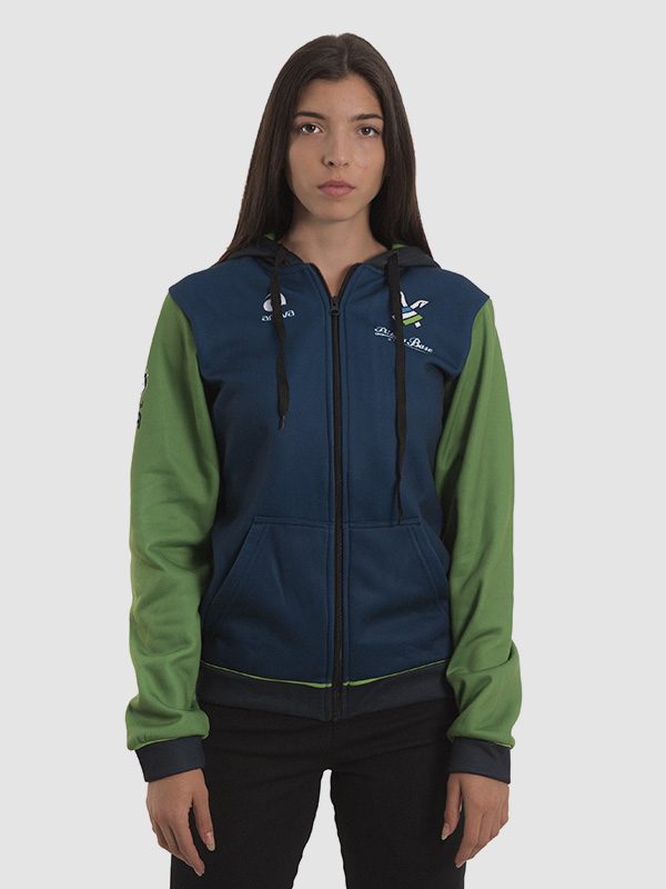 A female model wearing a dark blue/green hooded football tracksuit with black drawstrings, green sleeves, and black sleeve hems. Front is shown.