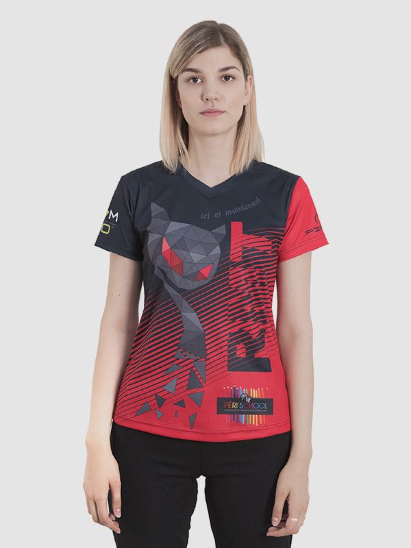 A female model wearing an all over sublimation printed red, black, and gray t-shirt. Front side is shown.