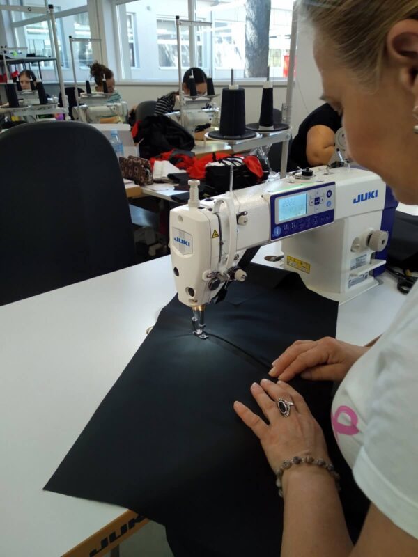 JUKI DDL 8000A loctstitch sewing machine used by an operator in a clothing factory