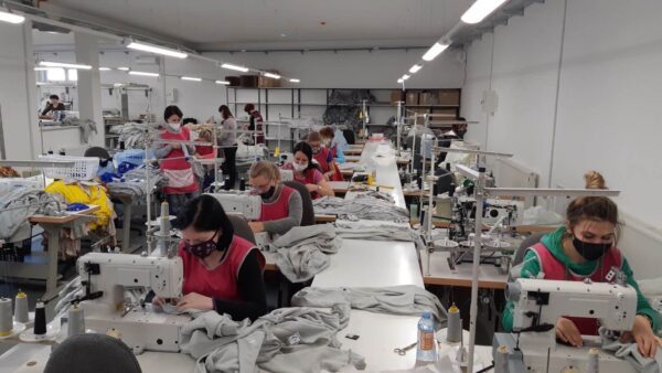 Sewing technicians working in a European clothing factory.